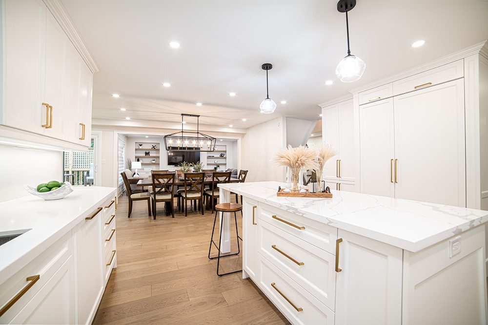 Modern kitchen with white cabinetry and light hardwood floors